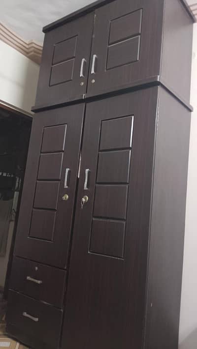 Modern double door wooden wardrobe with top storage box