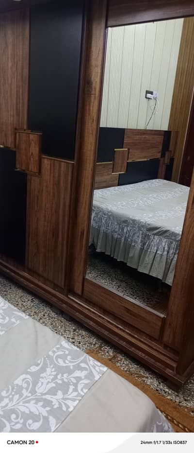 bed with side tables and wardrobe