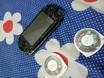 PSP With 2 iconic disc