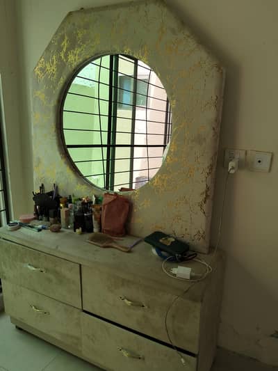 bed with side door and dressing table