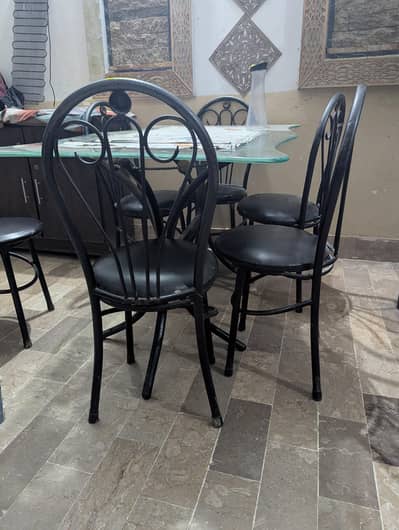 Iron Dinning table with 6 chair top curved glass design