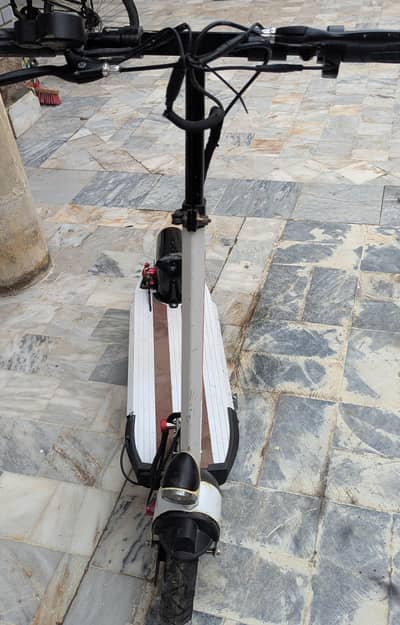 standy electric scooty
