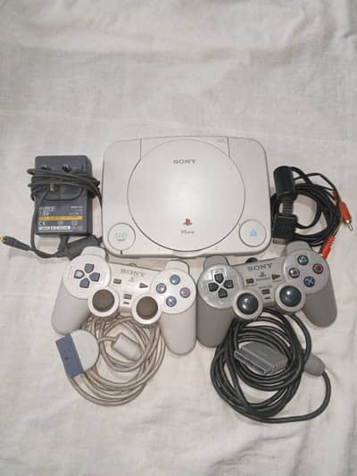 PS1 with two wired controllers and 24 games.