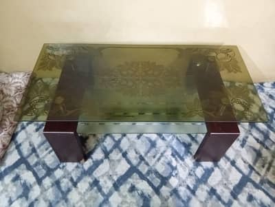 Modern glass center table with wooden base