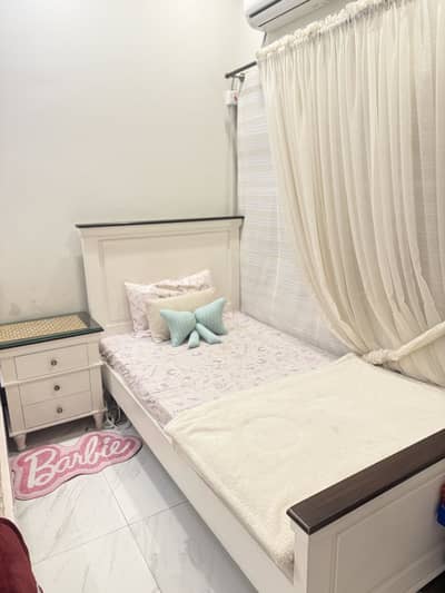 Bed with side table