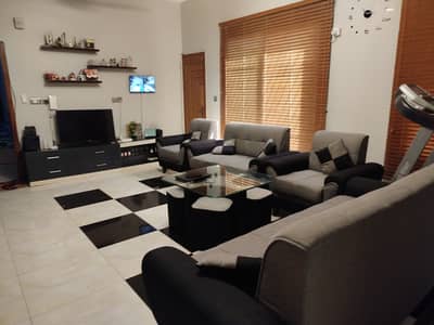 Condition 10/8 used neat seven seater sofa set grey black