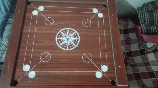I'm selling carrom board condition 10by10 3 by 3 feet