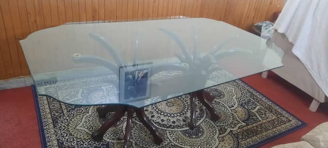 Glass  dining table with 4 wooden chairs available in very good qualit