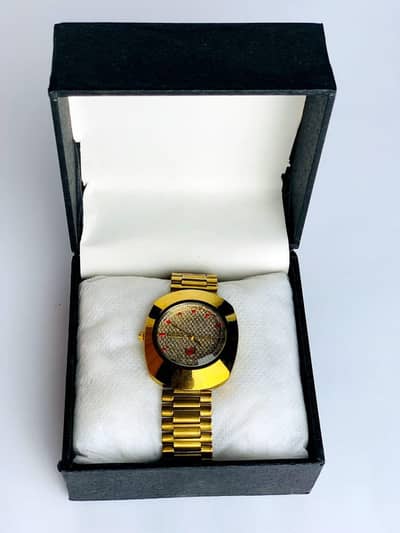 Men’s gold stainless steel watch with red accents