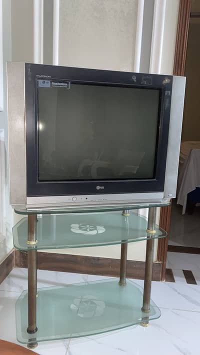 LG Tv with glass table
