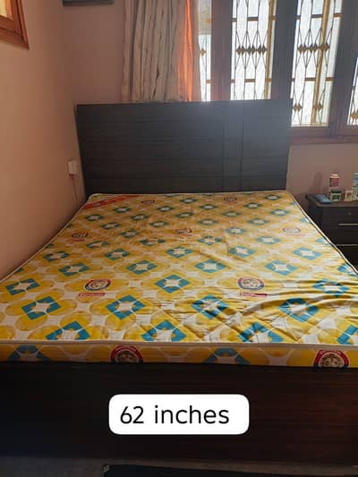wooden bed with mattress and 2 side tables