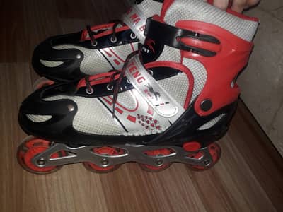 red & Black skating shoes , lightening wheels. .