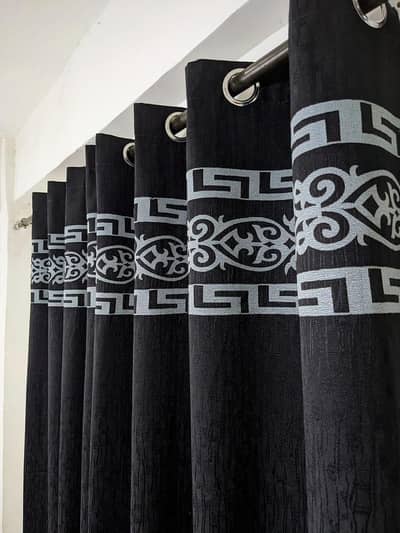 black jackquard curtain with silver motif design