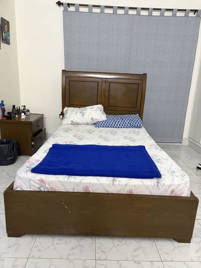 Brown wooden single bed