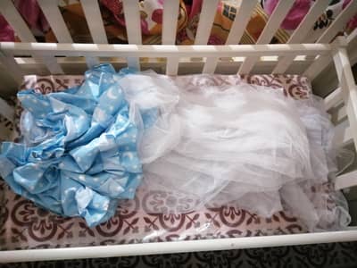 white wooden babycot with swim new mattress