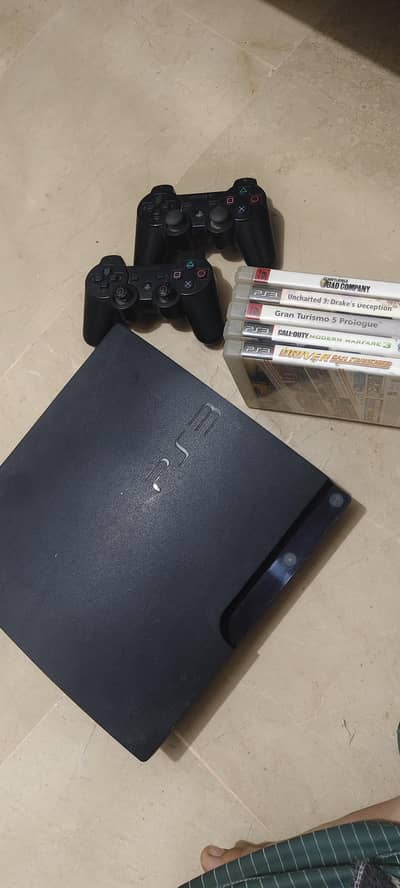 PS 3 with 2 controllers and 5 games