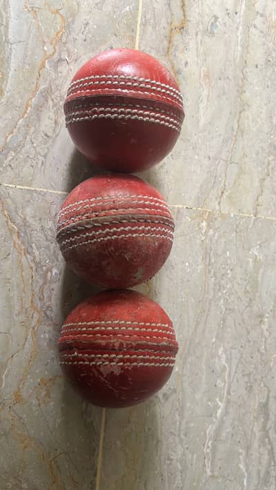 3 red hard balls