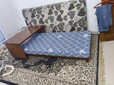 pure wooden bed with sliding table
