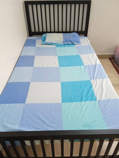 single iron bed with mattress