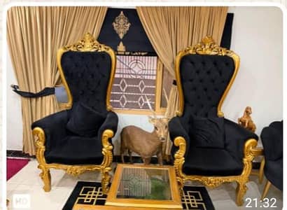 2 presidential chairs with 1 table. .