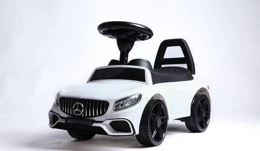 kids riding car black and white color