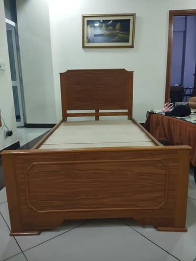 wooden single bed