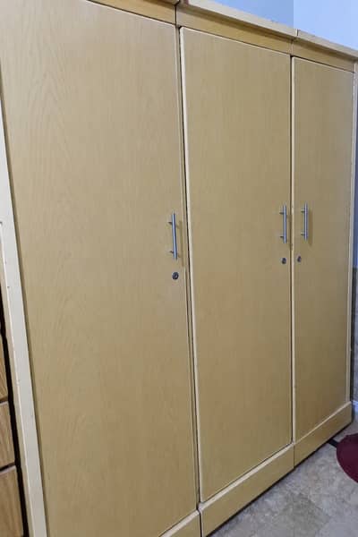 Wooden 3-door wardrobe for sale. Used but in good condition. Strong a