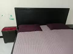 king size bed along with 2 side tables and a  spring mattress