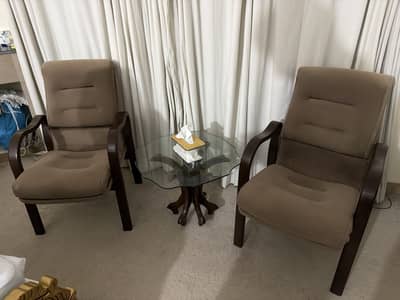 2 velvet wooden chairs and a coffee table for sale