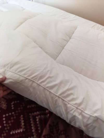 mattress topper new . queen size bed .