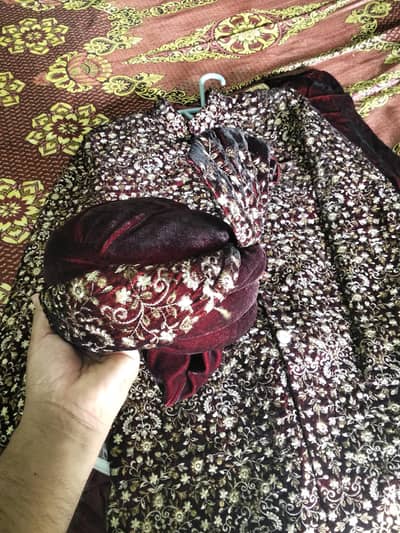 groom sherwani in mehroon color