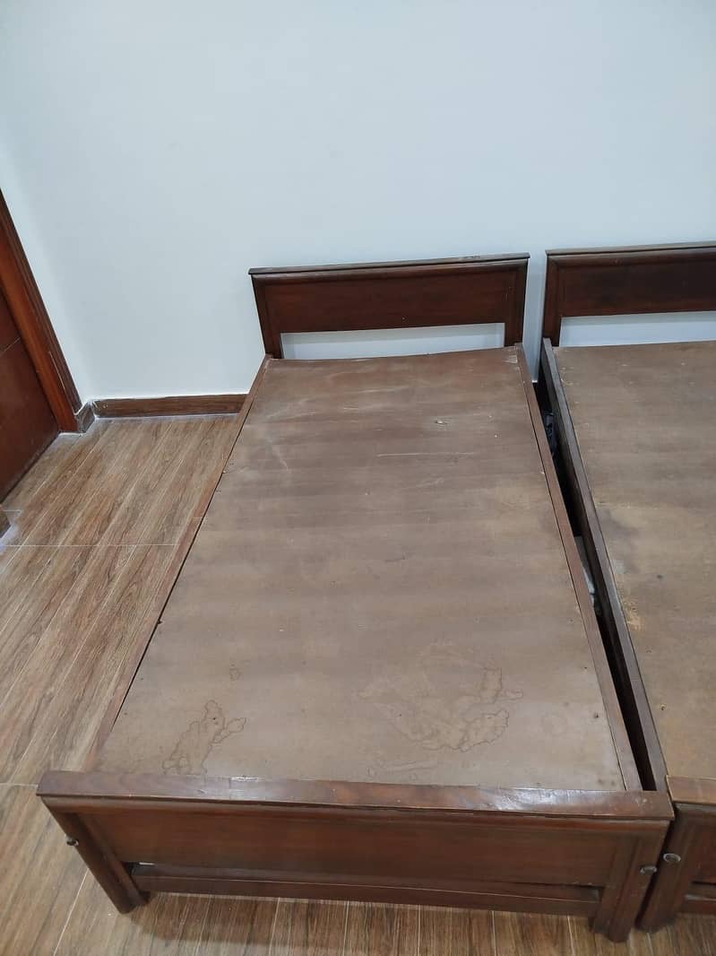 Two wooden single beds 1