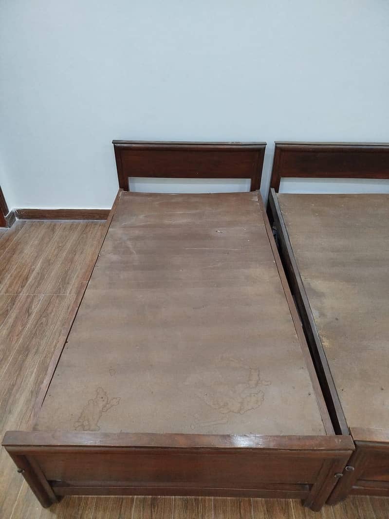 Two wooden single beds 2