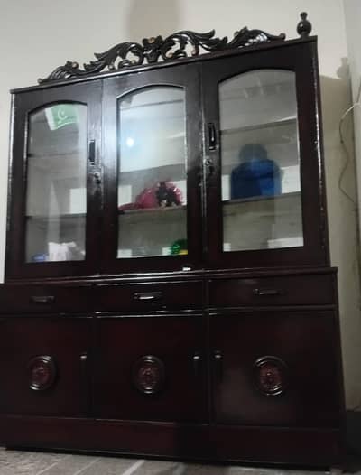 wooden cupboard with drawers and glass doors