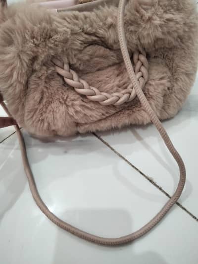 its furry bag