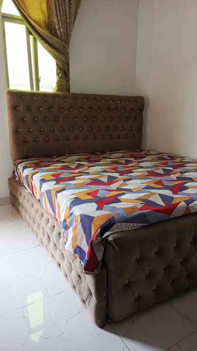 bed without mattress and 1 side table
