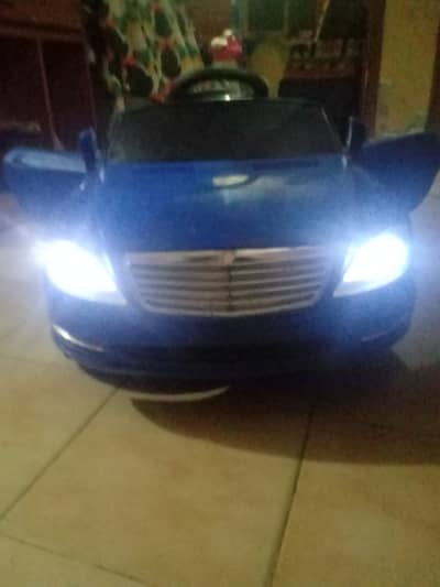 ELECTRIC KIDS CAR WITH MODIFIED SPEED 12/VOLT AGE 3/8 YRs.