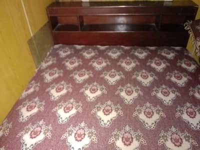 wooden bed and torly
