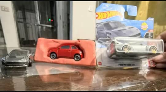 fiat e 500 with openable trunk and Ford mustang GTD and Tesla model 3