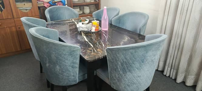 Dining Table with marble top and 6 comfortable chairs