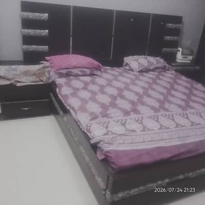 well maintained double bed with dressing