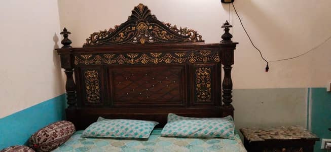 double bed with side tables and dressing table