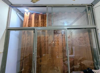 Moveable glass and metal grill
