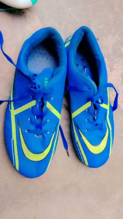 blue grippers and green stud kits for football