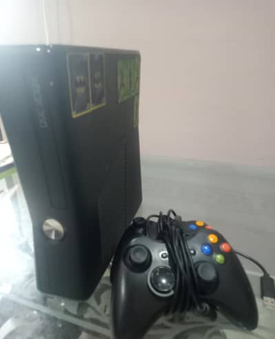 XBox 360 slim Jtagged two wireless controllers along with 20-22 games