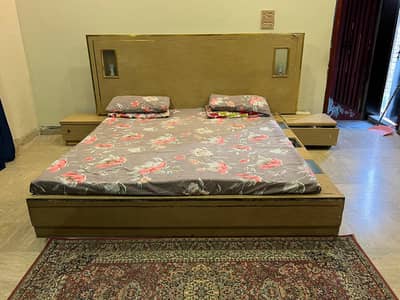 wooden bed without mattress