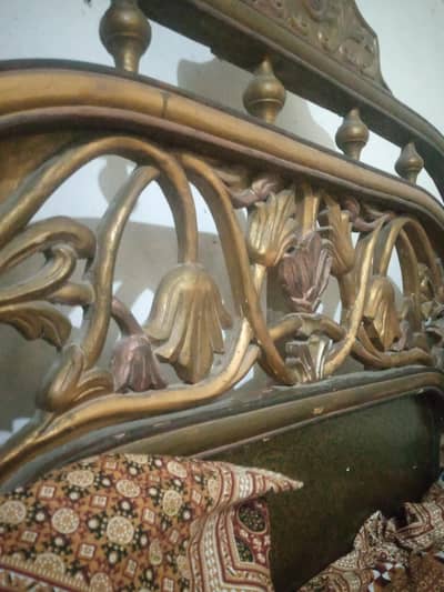 wooden bed in used condition