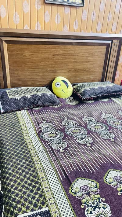 Wooden bed set is available for  sale