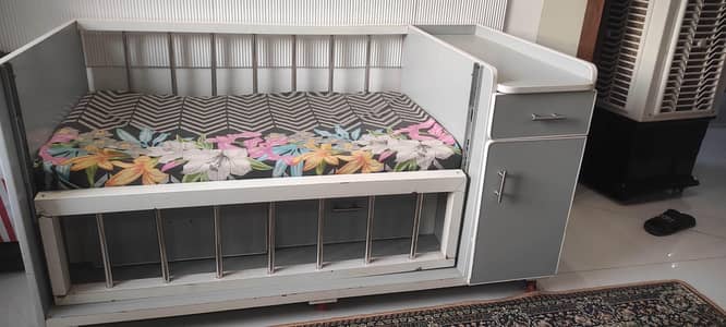 Wooden Baby Cot (with mattress and changing area) up for sale