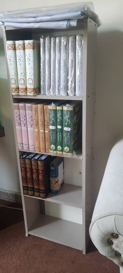 Bookshelf + Hajj guide + Map of Hijrat-e-Nabwi +Islamic books